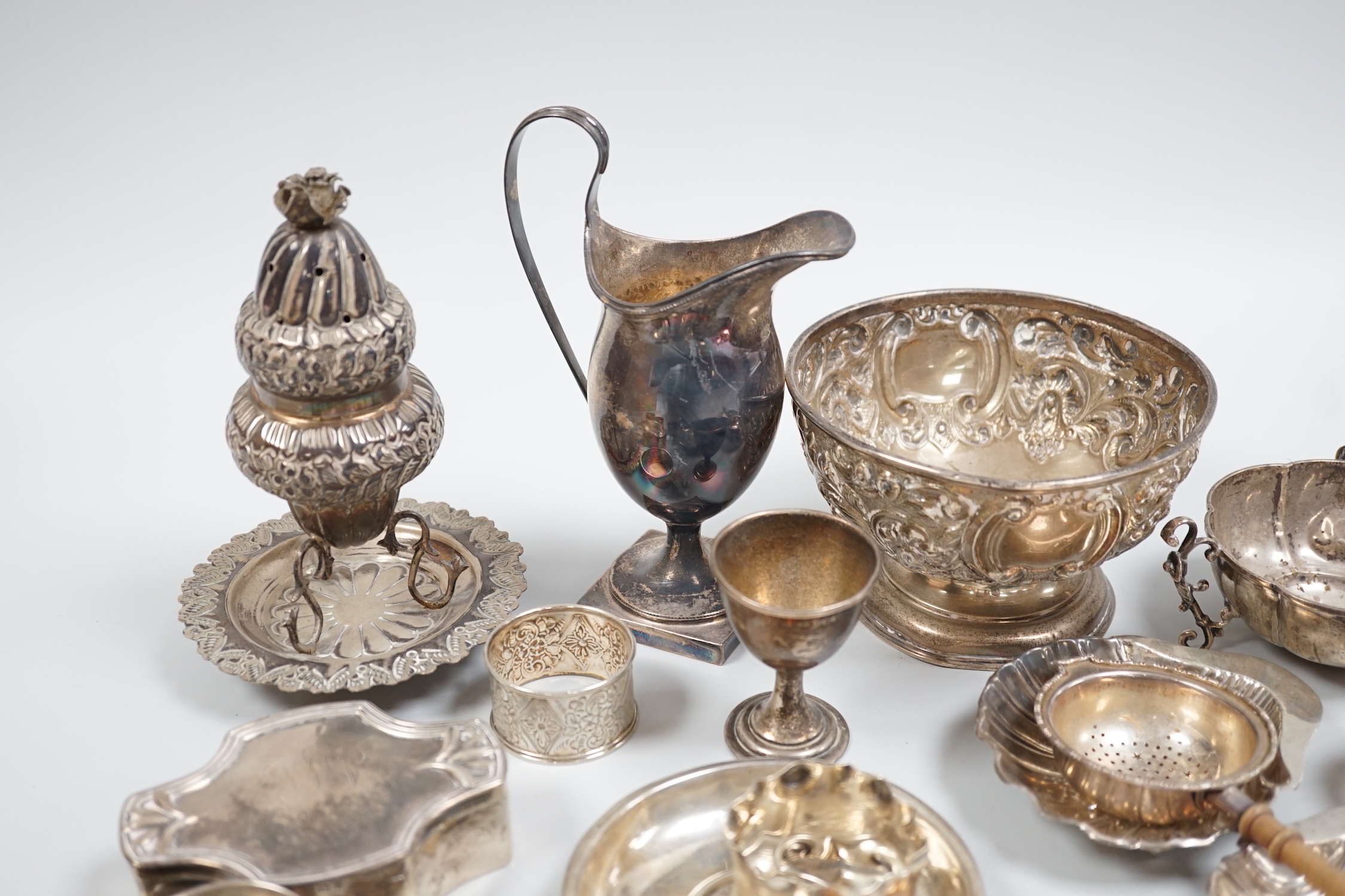 Sundry silver and white metal items including a pair of butter shells, small rose bowl, trinket box, cream jug, napkin rings and Egyptian scent? holder.